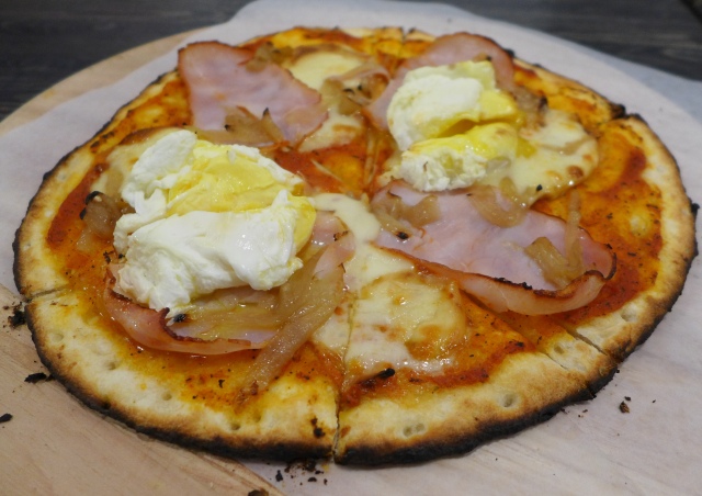 Bacon and Eggs Pizza: Back Bacon, Caciocavallo Cheese, Onion Jam, Two Eggs, Fire-Roasted Tomato Sauce